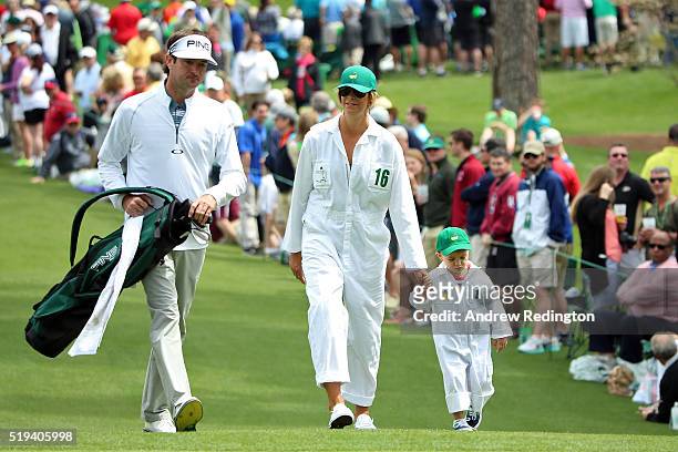 Bubba Watson of the United States walks with his wife Angie Watson and their son Caleb during the Par 3 Contest prior to the start of the of the 2016...
