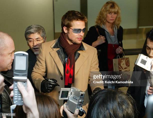 Actor Brad Pitt arrives at New Tokyo International Airport January 12, 2005 in Narita, Japan. Pitt is in Japan to promote his latest film, "Ocean's...