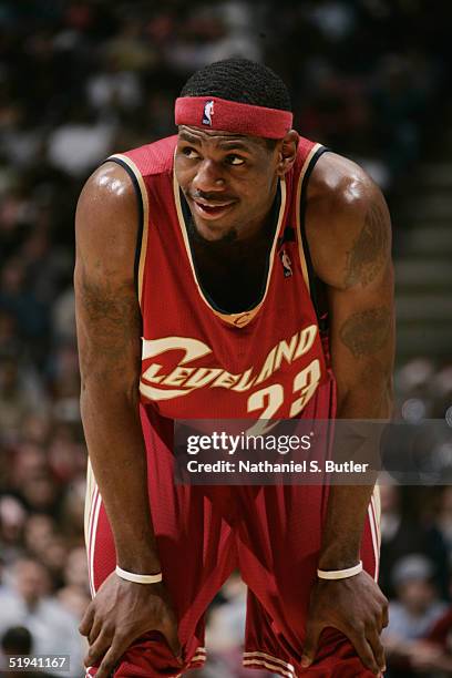 LeBron James of the Cleveland Cavaliers rests during the game against the New Jersey Nets at the Continental Airlines Arena on December 22, 2004 in...