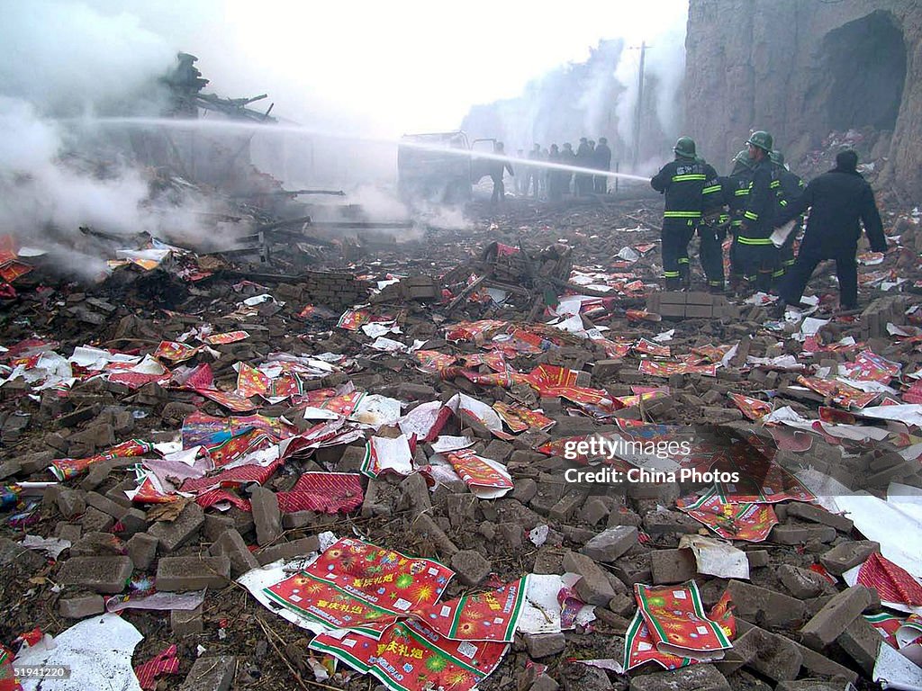 Firework Factory Explodes Firemen put out fire in the debris after a firework factory explosion ...