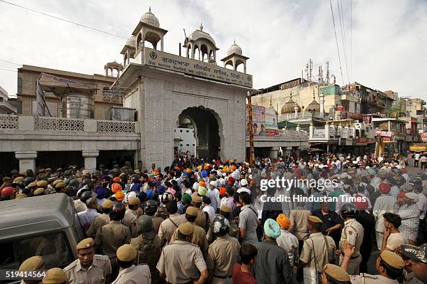 Sikh Community protesting after a drinking water kiosk near Gurdwara Sheeshganj Sahib was dismantled during encroachment removal drive undertaken by...