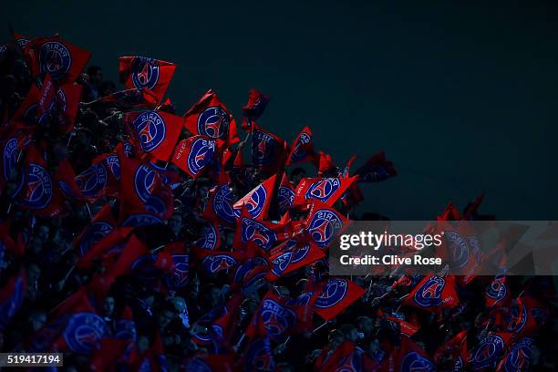 Paris Saint-Germain supporters wave flags prior to the UEFA Champions League Quarter Final First Leg match between Paris Saint-Germain and Manchester...