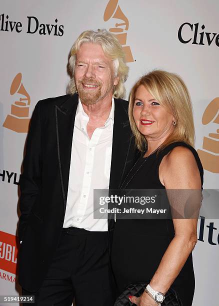 Businessman Richard Branson and Joan Templeman attend the 2016 Pre-GRAMMY Gala and Salute to Industry Icons honoring Irving Azoff at The Beverly...
