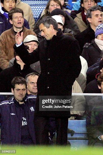 Jose Mourinho of Chelsea reacts with dismay after appealing with the fourth official for more added-on time during the Carling Cup semi-final first...