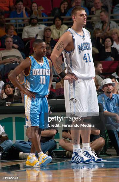 Earl Boykins of the Denver Nuggets stands next to Mario Kasun of the Orlando Magic during the game at TD Waterhouse Centre on December 18, 2004 in...