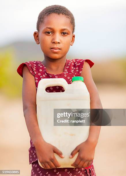 african girl with a water jug - sweet charity stock pictures, royalty-free photos & images