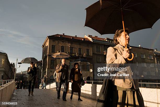 people on latin bridge in sarajevo, bosnia - bosnian rainbows stock pictures, royalty-free photos & images