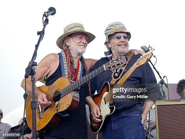 Merle Haggard performs with Willie Nelson during Willie Nelson's 4th of July Picnic at the Spicewood Springs Amphitheater on July 4, 2003 in Austin,...
