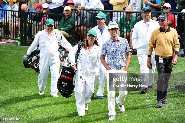 Kevin Na of the United States and Lydia Ko walk during the Par 3 Contest prior to the start of the 2016 Masters Tournament at Augusta National Golf...