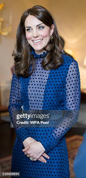 Catherine, Duchess of Cambridge smiles as she attends a reception ahead of their tour of India and Bhutan at Kensington Palace on April 6, 2016 in...