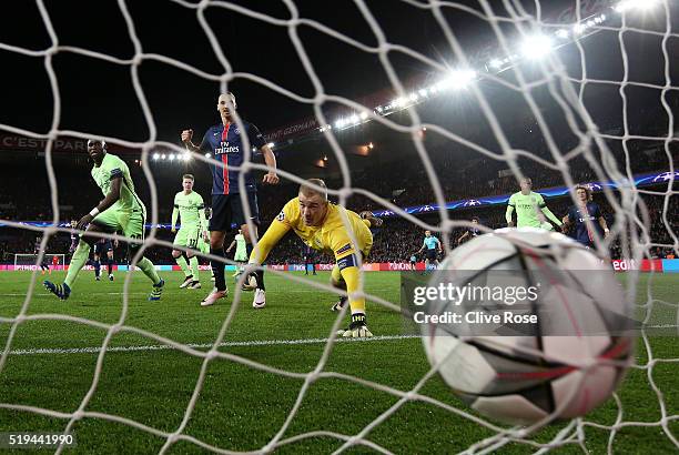 Joe Hart of Manchester City dives in vain as Adrien Rabiot of Paris Saint-Germain scores his team's second goal during the UEFA Champions League...