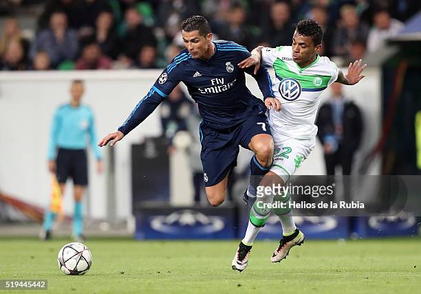 Cristiano Ronaldo of Real Madrid and Luiz Gustavo of Wolfsburg compete for the ball during UEFA Champions League Quarter Final: First Leg match...