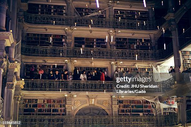 View of one side of the upper levels of the George Peabody Library at Johns Hopkins University, students are on one of the levels, 2015. Courtesy...