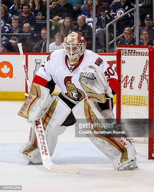 Goaltender Andrew Hammond of the Ottawa Senators guards the net during third period action against the Winnipeg Jets at the MTS Centre on March 30,...