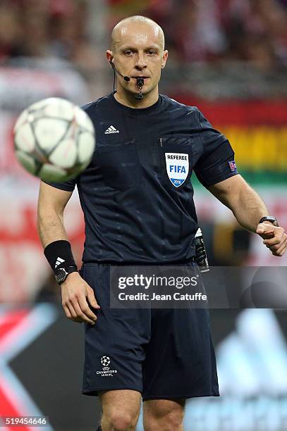 Referee Szymon Marciniak of Poland gestures during the UEFA Champions League quarter final first leg match between FC Bayern Muenchen and SL Benfica...