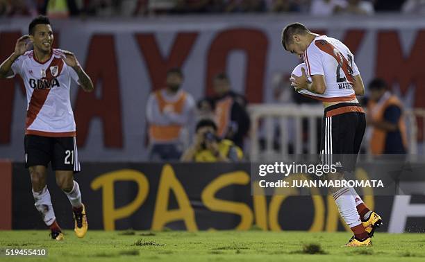 Argentina's River Plate defender Emanuel Mammana celebrates with teammate defender Leonel Vangioni after scoring the team's fourth goal against...