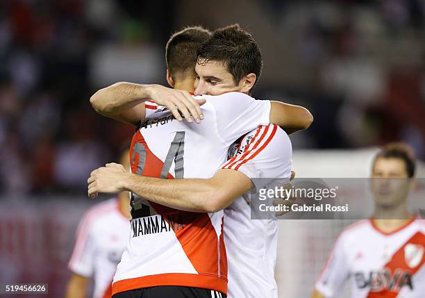 Emanuel Mammana of River Plate celebrates with teammate Lucas Alario after scoring the fourth goal of his team during a match between River Plate and...