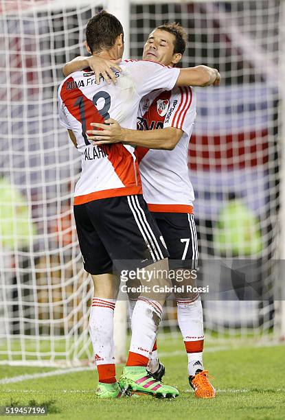 Lucas Alario of River Plate celebrates with teammates Rodrigo Mora after scoring the fifth goal of his team during a match between River Plate and...