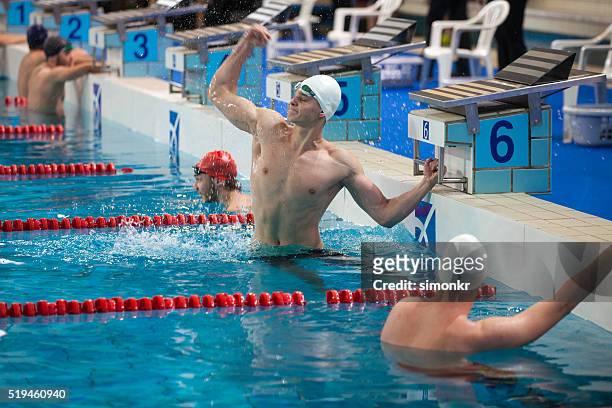 male swimmer in swimming pool - swimming competition stock pictures, royalty-free photos & images