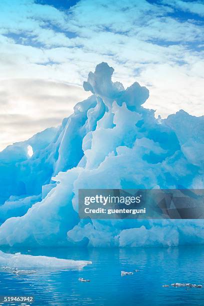 bizarre shaped iceberg in the arctic sea - xxl image - glacier stock pictures, royalty-free photos & images