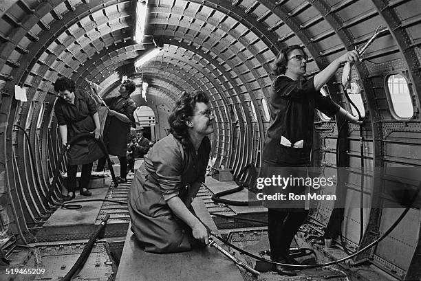 Cleaners at work on the prototype supersonic airliner Concorde 002, at the British Aircraft Corporation works at Filton, Bristol, 30th January 1967.