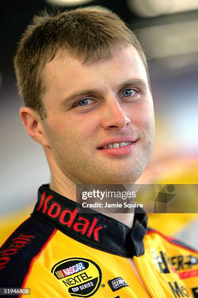 Travis Kvapil, driver of the Kodak Dodge, poses in the garage during the NASCAR NEXTEL Cup testing at the Daytona International Speedway on January...