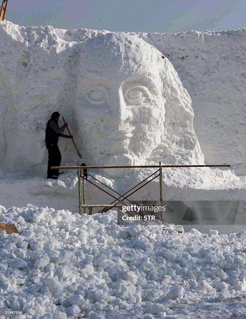 A worker puts the finishing touches on a
