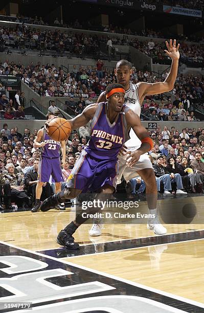 Amare Stoudemire of the Phoenix Suns drives baseline against Tim Duncan of the San Antonio Spurs during the game at SBC Center on December 28, 2004...