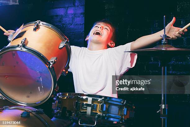 boy playing drums - hitting drum stock pictures, royalty-free photos & images