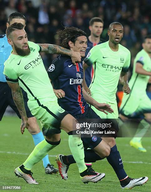 Edinson Cavani of Paris Saint-Germain in action with Nicolas Otamendi of Manchester City FC during the UEFA Champions League Quarter Final between...