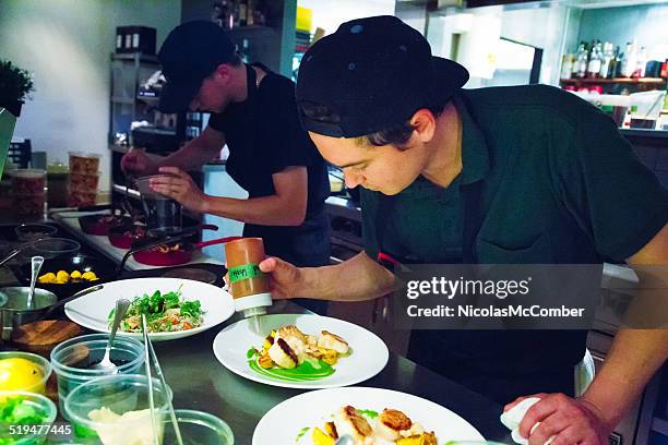 chef putting finishing touches to plating his dishes - perfection salad stock pictures, royalty-free photos & images