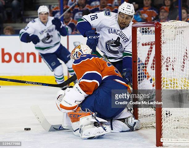 Goaltender Cam Talbot of the Edmonton Oilers makes a save on Emerson Etem of the Vancouver Canucks on April 6, 2016 at Rexall Place in Edmonton,...