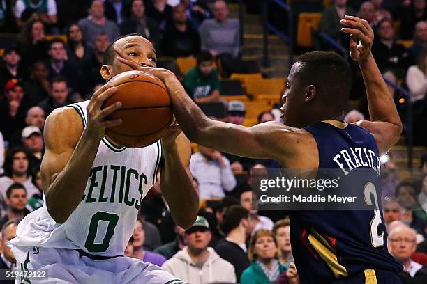 Tim Frazier of the New Orleans Pelicans blocks a shot by Avery Bradley of the Boston Celtics during the fourth quarter at TD Garden on April 6, 2016...