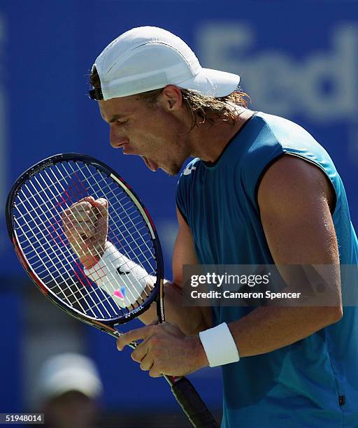 Lleyton Hewitt of Australia celebrates a point during his match against Thomas Johansson of Sweden during day five of the Medibank Private...