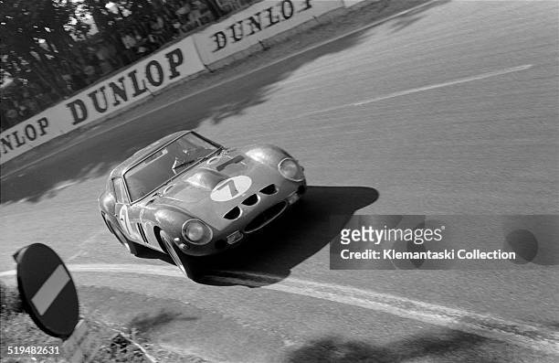 The four litre Ferrari GTO driven by Michael Parkes and Lorenzo Bandini, 24 Hours of Le Mans, Le Mans, France, June 1962. It retired due to...