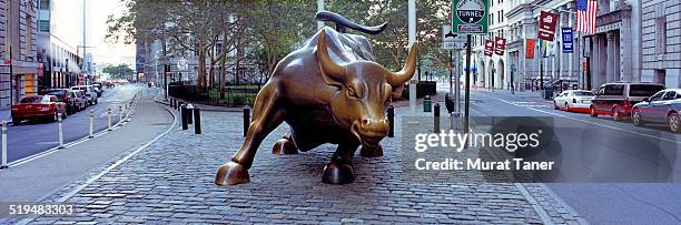 charging bull sculpture near wall street - charging bull statue stock pictures, royalty-free photos & images