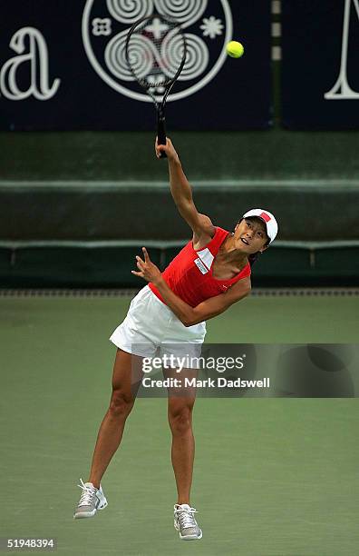 Zi Yan serves in her match with Jie Zheng of China against Alina Jidkova of Russia and Tatiana Perebeynis of the Ukraine during day five of the...