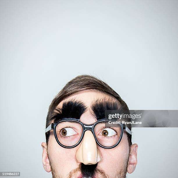 classic disguise glasses on man - mask joke stockfoto's en -beelden