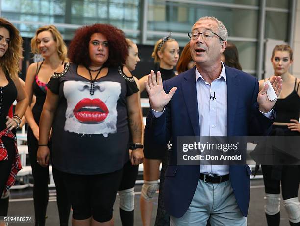 Casey Donovan looks on as Ben Elton talks to the media during rehearsals for We Will Rock You at ABC Studios on April 7, 2016 in Sydney, Australia.