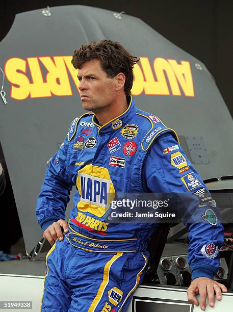 Michael Waltrip, driver of the Napa Auto Parts Chevolet, waits in the garage area during NASCAR NEXTEL Cup testing at the Daytona International...