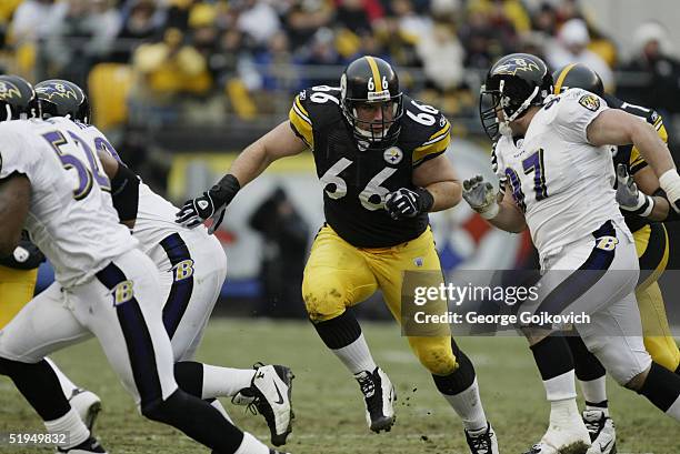 Guard Alan Faneca of the Pittsburgh Steelers blocks against the Baltimore Ravens at Heinz Field on December 26, 2004 in Pittsburgh, Pennsylvania. The...