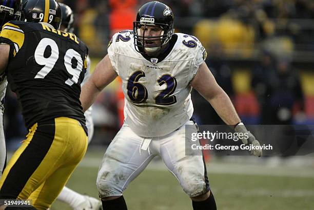 Guard Mike Flynn of the Baltimore Ravens pass blocks against the Pittsburgh Steelers at Heinz Field on December 26, 2004 in Pittsburgh, Pennsylvania....