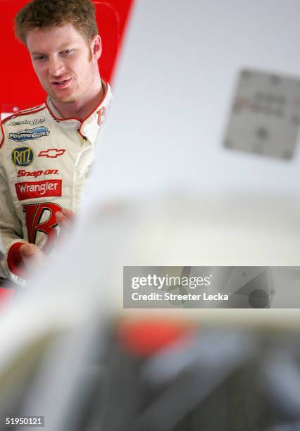 Dale Earnhardt Jr., driver of the Budweiser Chevrolet, stands in the garage during Nascar Nextel Cup testing, on January 13, 2005 at Daytona...