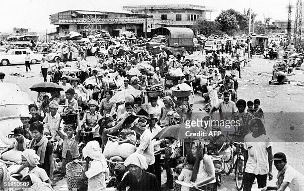 An archive picture from Agence Khmere de Presse shows Cambodian people leaving Phnom Penh after Khmer Rouge forces seized and emptied the Cambodian...