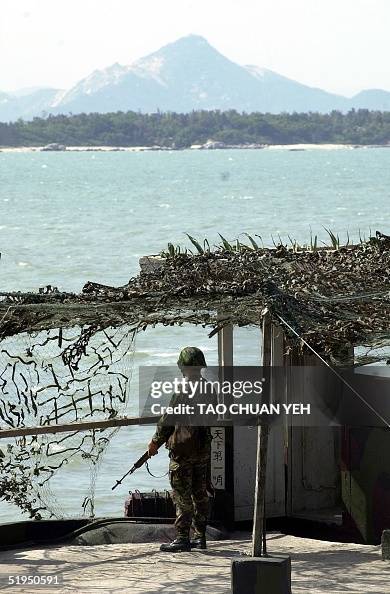 An armed sentinel stands guard at a base on Kinmen An armed sentinel stands guard at a base on Kinmen