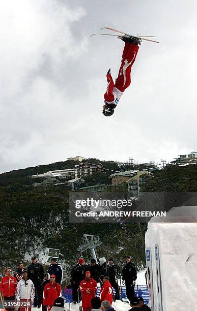 Current World Aerial Freestyle champion Jacqui Cooper from Australia flies upside down through the air above spectators on her way to winning the...