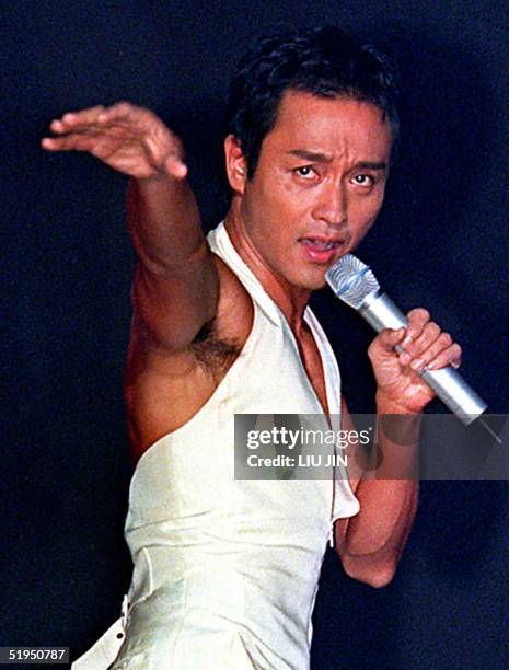 Hong Kong's king of pop, singer Leslie Cheung performs on the stage during a concert at Shanghai Stadium late 16 September 2000. Cheung retired from...