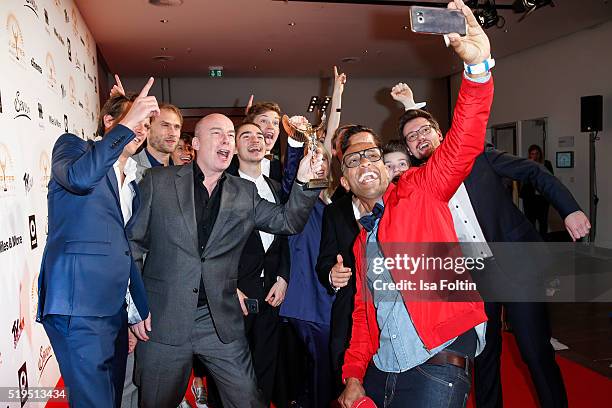 Ermias 'Amiaz' Habtu with some award winners and smart attend the Jupiter Award 2016 on April 06, 2016 in Berlin, Germany.