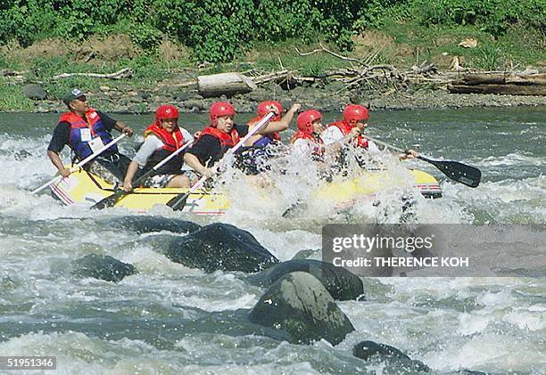 Philippine president Gloria Arroyo , with government officials, went white water rafting on the Mambuaya River in Cagayan de Oro, southern...