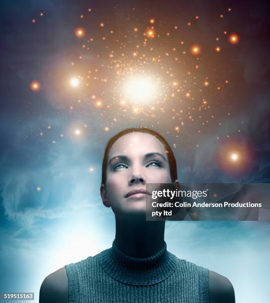 pacific islander woman admiring glowing lights in sky - magical thinking stock pictures, royalty-free photos & images